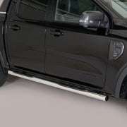 A black pickup truck shown from the side, featuring a long silver chrome side step running along the lower door.